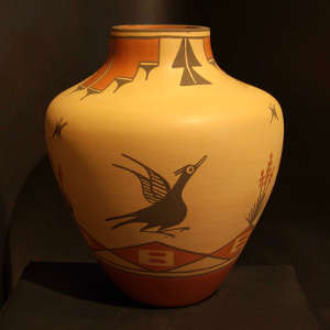 Bird and geometric design on a polychrome jar