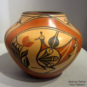 Click to see a larger version A cloud, bird, rainbow and geometric design on a polychrome jar