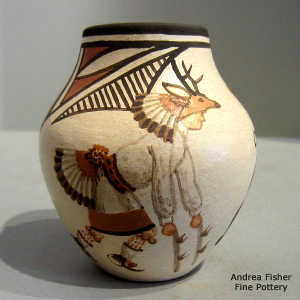 Dancer, bird and geometric design on a polychrome jar