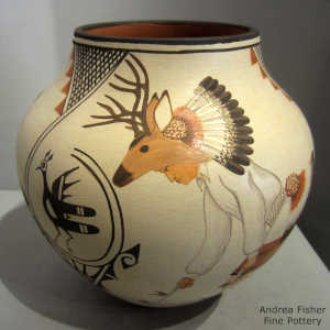 Bird, deer, deer dancer and geometric design on a polychrome jar