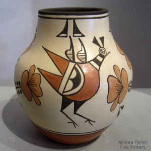 Roadrunner, flower and geometric design on a polychrome jar