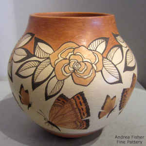 Butterfly, flower and geometric design on a polychrome jar