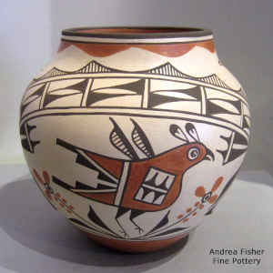 Bird, flower and geometric design on a polychrome jar