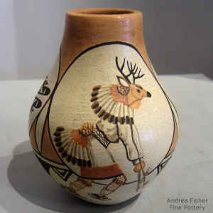 Deer dancer, bird and geometric design on a polychrome jar