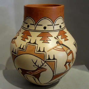 Traditional and contemporary designs on a polychrome pot