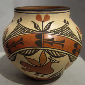 Bird, rainbow and geometric designs on a polychrome pot