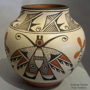 Moth, floral and geometric design on a polychrome jar
