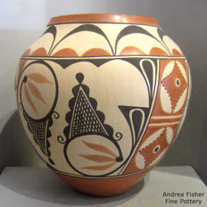 Cloud, floral and geometric design on a polychrome jar