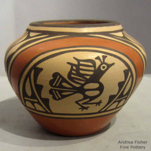 Bird, rainbow, cloud and geometric designs on a Polychrome olla