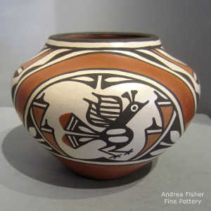 Roadrunner, rainbow and geometric design on a polychrome jar