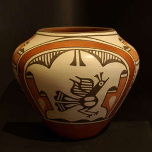 Bird, rainbow and geometric designs on a polychrome jar