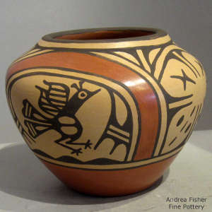 Roadrunner, rainbow and geometric design on a polychrome jar