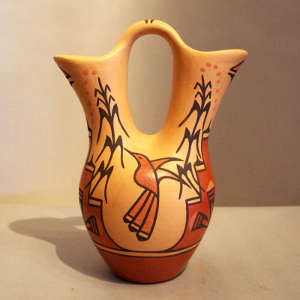 Hummingbird, kiva step, corn and geometric design on a polychrome wedding vase