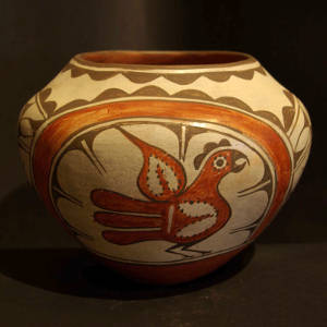Rainbow, bird and cloud design on a polychrome jar