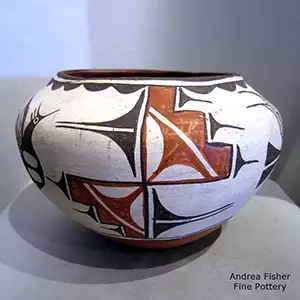 A 2-panerl roadrunner and geometric design on a polychrome jar