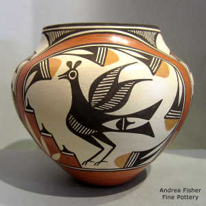 Bird, cloud, rainbow and geometric design on a polychrome jar