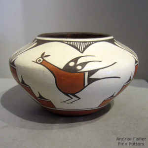 Roadrunner, rain, cloud and geometric design on a polychrome jar