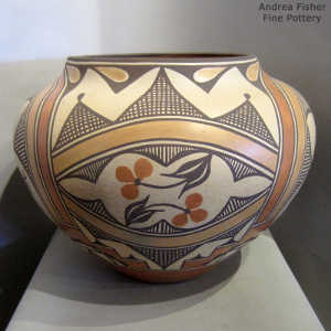 Rainbow, bird and cloud design on a polychrome jar