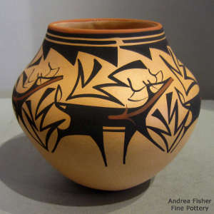 Deer, heart line and geometric design on a polychrome jar