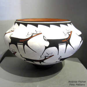 Deer, heart line and geometric design on a polychrome jar