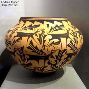 Deer, heart line and geometric design on a polychrome jar