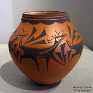 Deer, heart line and geometric design on a black on red jar