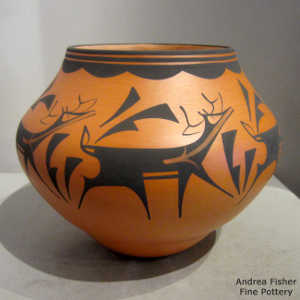 Deer, heart line and geometric design in black on an orange ware jar