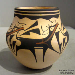 Deer, heart line and geometric design on a polychrome jar