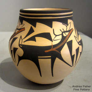 Deer, heart line and geometric design on a polychrome jar