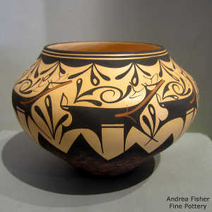 Deer, heart line and geometric design on a polychrome jar