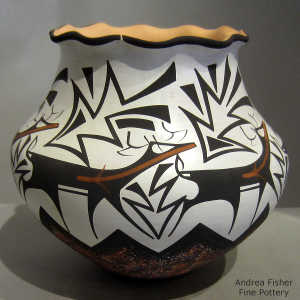 Deer, heart line and geometric design on a polychrome jar with a pie crust rim