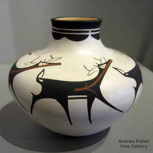 Deer, heart line and geometric design on a polychrome jar