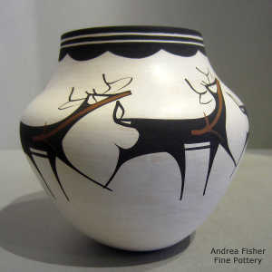 Deer, heart line and geometric design on a polychrome jar