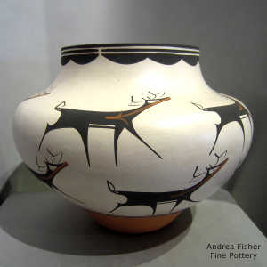 Deer, heart line and geometric design on a polychrome jar