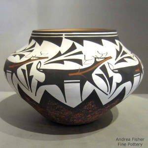 Deer, heart-line and geometric designs on a polychrome jar