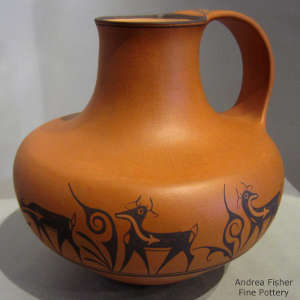 Deer, heart line and geometric design on an orange jar