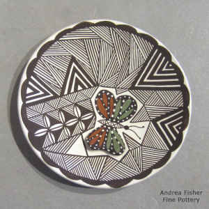Butterfly, fine line and geometric design on a polychrome plate