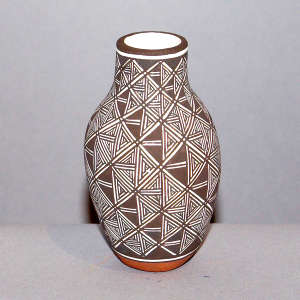 Fine line and swirl geometric design on a polychrome vase