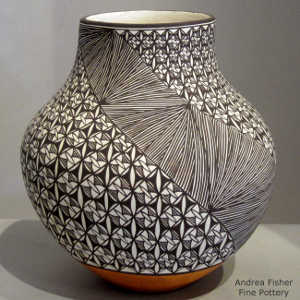 Swirl, fine line and geometric design on a polychrome jar