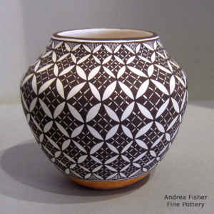 Pumpkin seed and geometric design on a polychrome jar