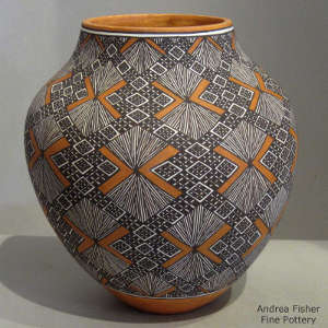Fine line and geometric design on a polychrome jar