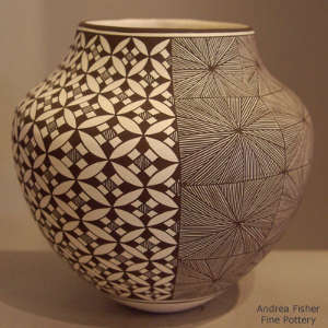 Half fine line and half gemotric design on a black and white jar