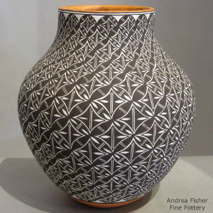 Black and white geometric design on a polychrome jar