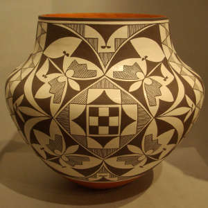 Black and white medallion design on a polychrome jar