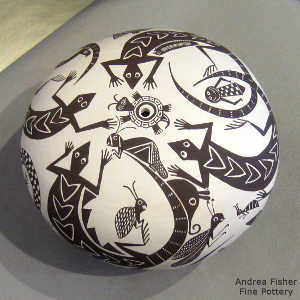 Insect, turtle and lizard design on a black and white seed pot