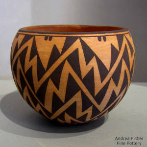 Mimbres lightning bolt design on a black on red jar