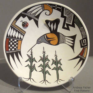 Hummingbird, corn plant and Mimbres shard designs decorate a polychrome plate