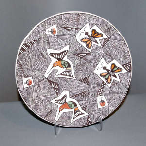 Fine line and geometric design on a polychrome plate with hummingbirds, butterflies and ladybugs