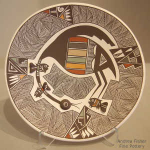 Cloudeater, fish, fine line and geometric design on a polychrome plate