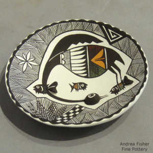 Cloud eater, rain, fish and geometric design on a polychrome plate